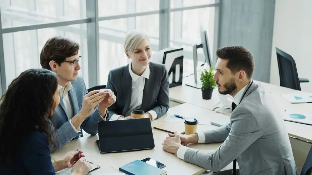 Diverse business team collaborating in a modern office at TIMKINGSFORD SOLUTIONS