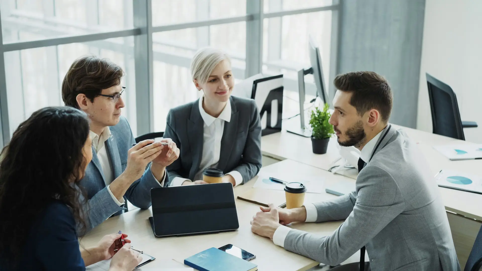 Diverse business team collaborating in a modern office at TIMKINGSFORD SOLUTIONS